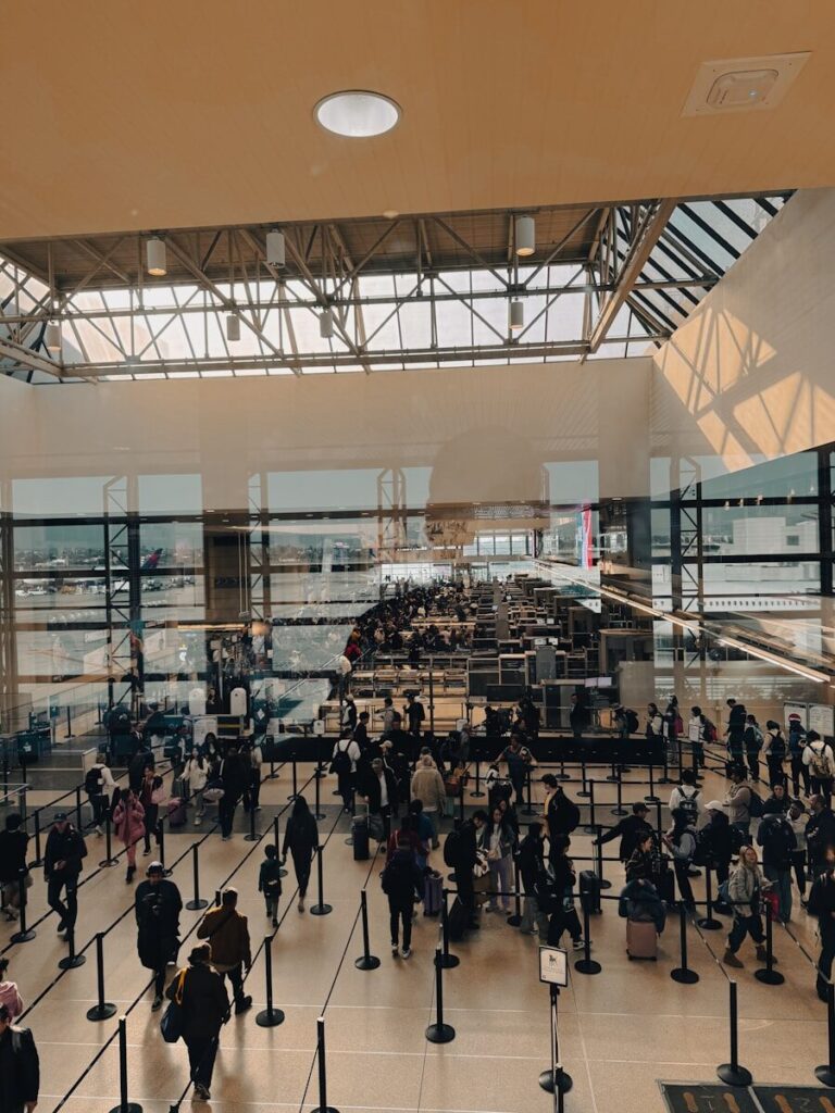 A large group of people walking around a building